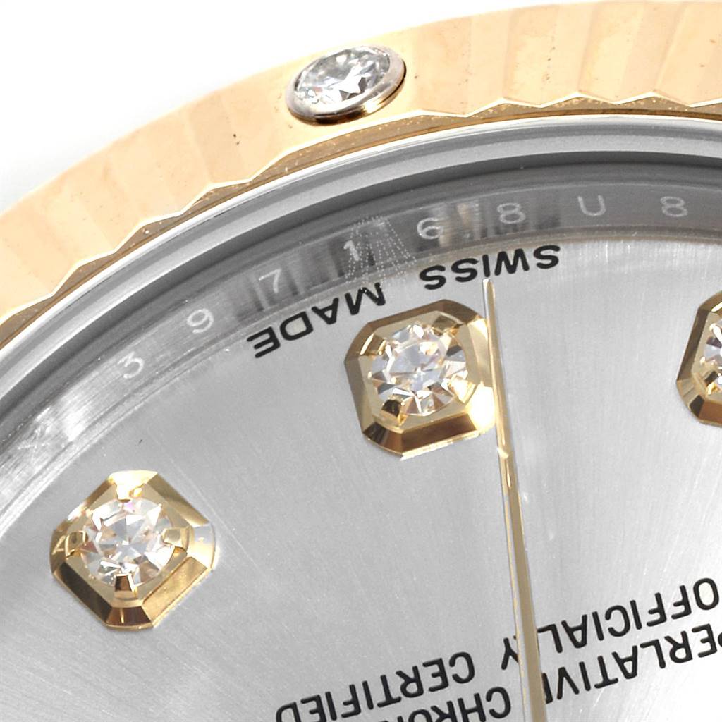 Close-up of the Rolex Mid-Size 178313 Women's Stainless Steel Silver Dial 178313 Women's Stainless Steel Silver Dial watch face showing diamond hour markers, gold bezel, and partial text.