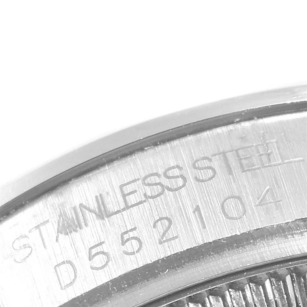 The image shows a close-up of the serial number and "STAINLESS STEEL" engraving on the case back of a Rolex Mid-Size 178240 Women's Stainless Steel Black Dial 178240 Women's Stainless Steel Black Dial watch. 