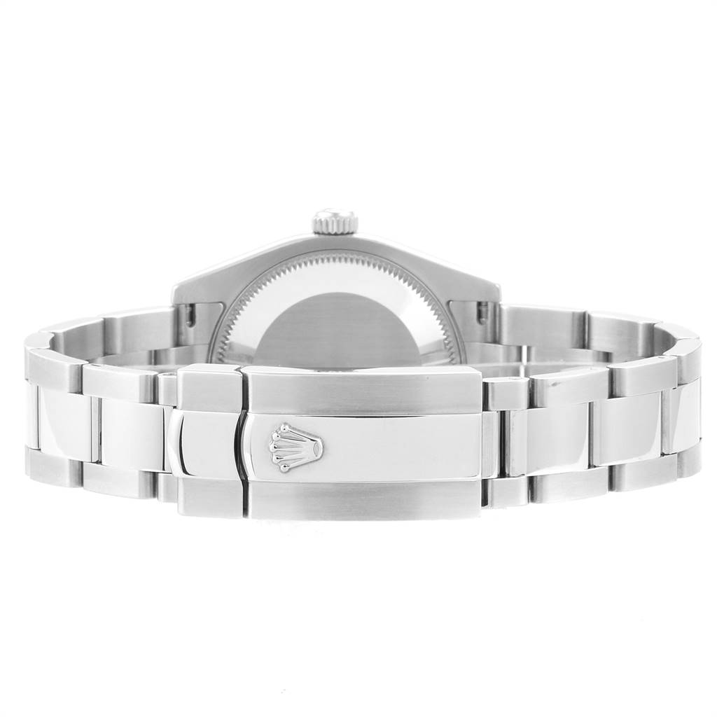 The image shows the back and clasp of a Mid-Size Rolex watch, highlighting the bracelet and case.