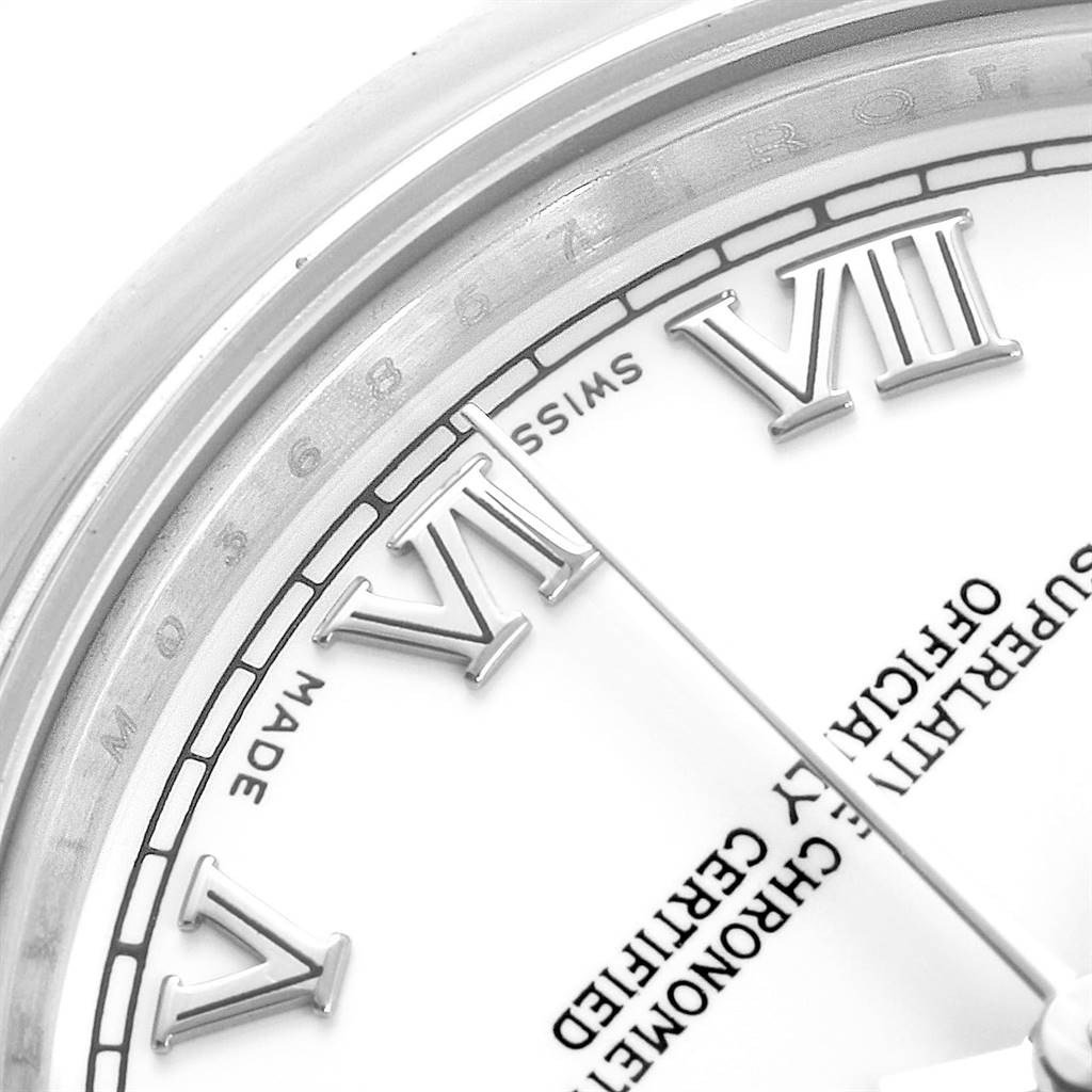 This close-up of a Rolex Mid-Size 178240 Women's Stainless Steel White Dial 178240 Women's Stainless Steel White Dial watch shows its dial, Roman numerals, and part of the bezel.