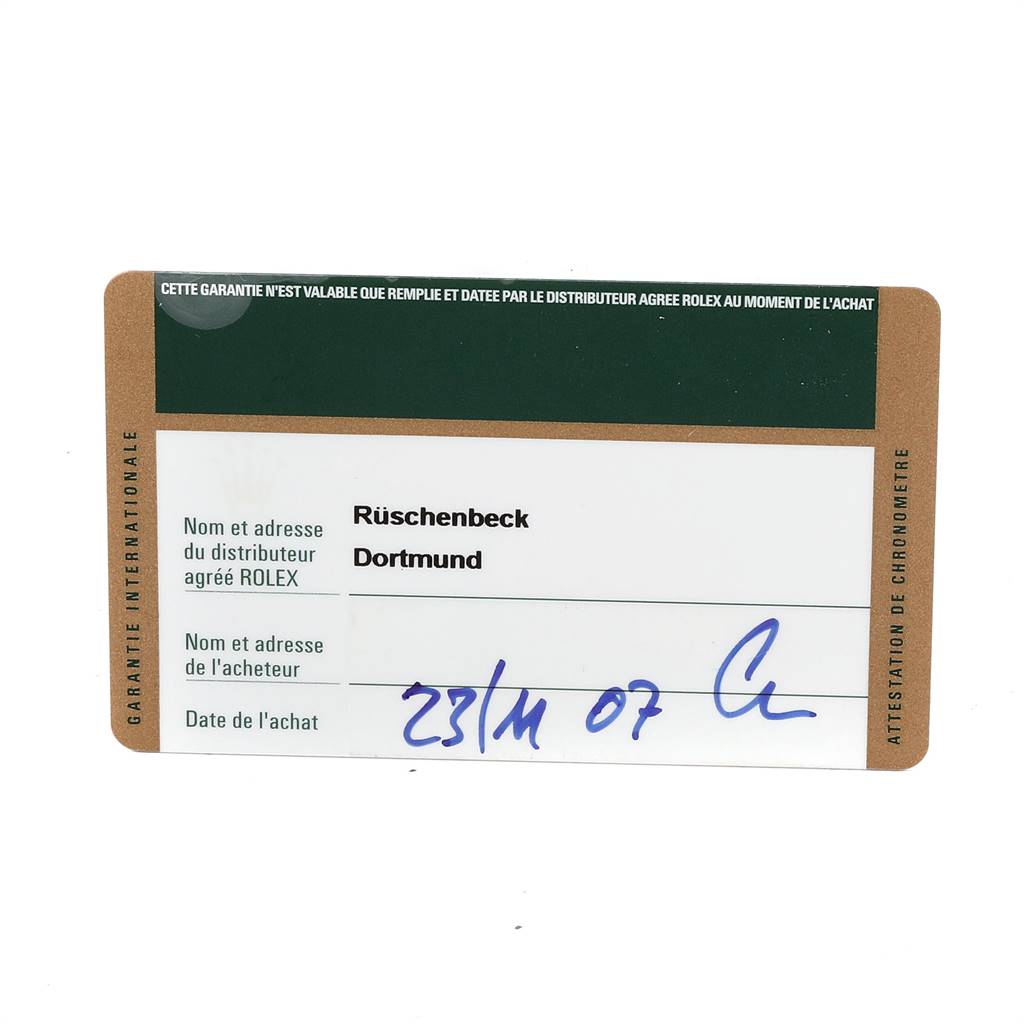 This image shows the warranty card for a Mid-Size Rolex watch, featuring dealer information and purchase date details.