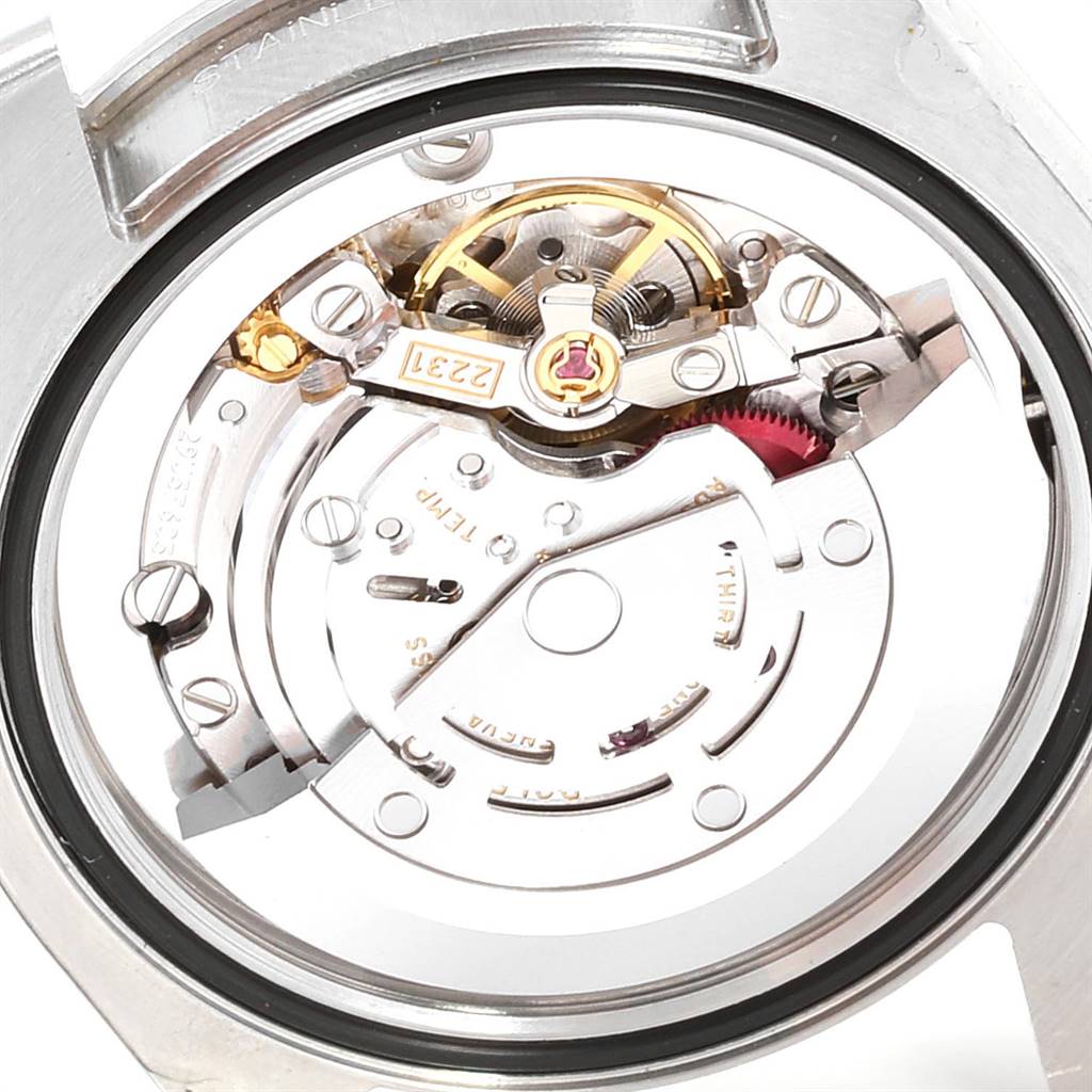 This image shows the internal movement mechanism of a Mid-Size Rolex watch from a rear angle.