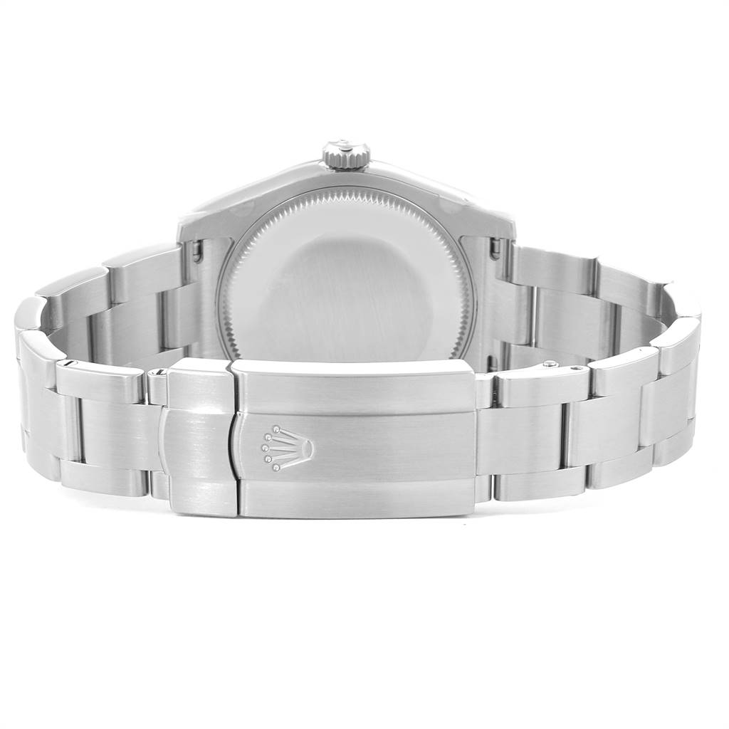 This image shows the back view of a Mid-Size Rolex watch, highlighting the case back and clasp.