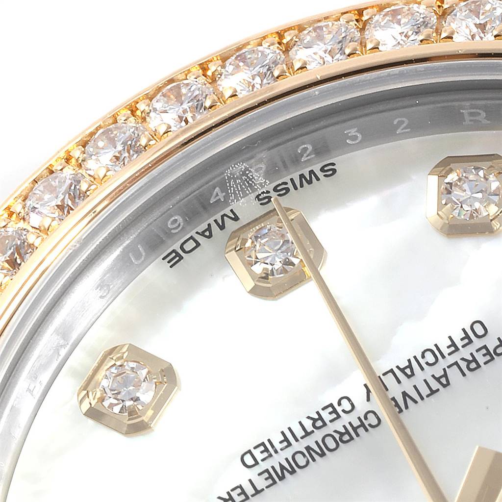 The image shows a close-up of the Rolex Mid-Size 178383 Women
s Steel and Gold (two tone) Mother of Pearl Dial 178383 Women
s Steel and Gold (two tone) Mother of Pearl Dial model, highlighting its jeweled bezel, part of the dial, and "SWISS MADE" inscription.