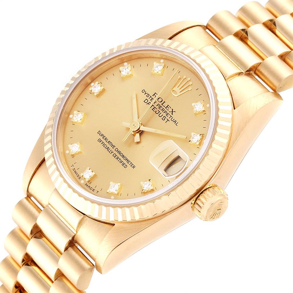 The Rolex Mid-Size 68278 Women's Yellow Gold Champagne Dial 68278 Women's Yellow Gold Champagne Dial model is shown at a slight angle, displaying its golden dial, diamond hour markers, bezel, crown, and part of the bracelet.