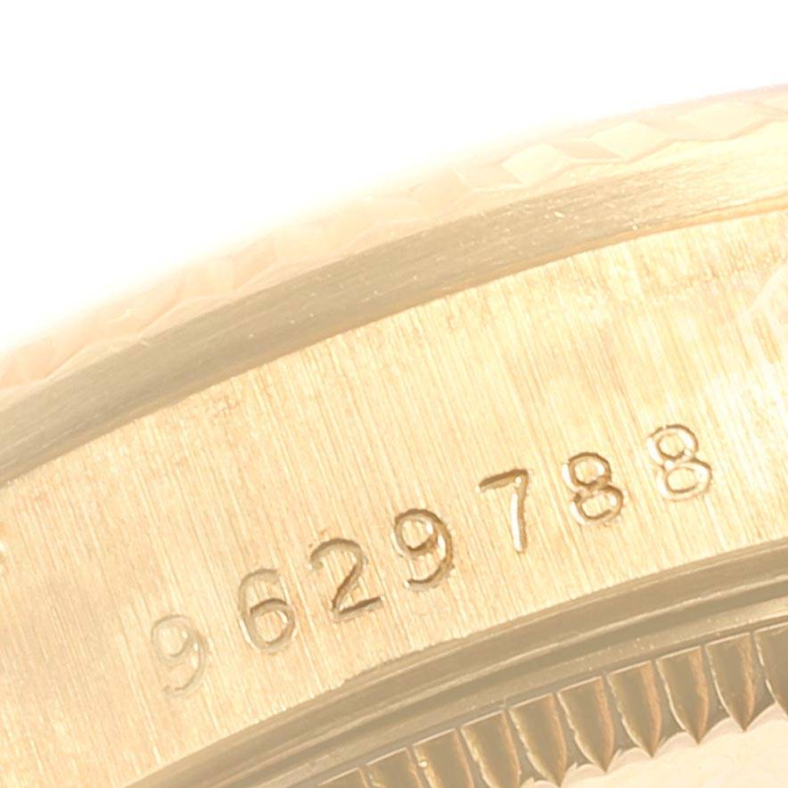 This close-up image shows the serial number engraved on the case of a Rolex Mid-Size 68278 Women's Yellow Gold Champagne Dial 68278 Women's Yellow Gold Champagne Dial watch.
