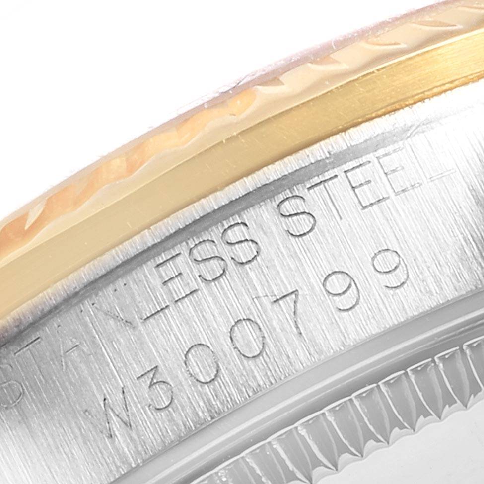 Close-up of the Rolex Mid-Size 68273 Women's Steel and Gold (two tone) Champagne Dial 68273 Women's Steel and Gold (two tone) Champagne Dial watch showing the edge of the bezel and the engraved stainless steel part.