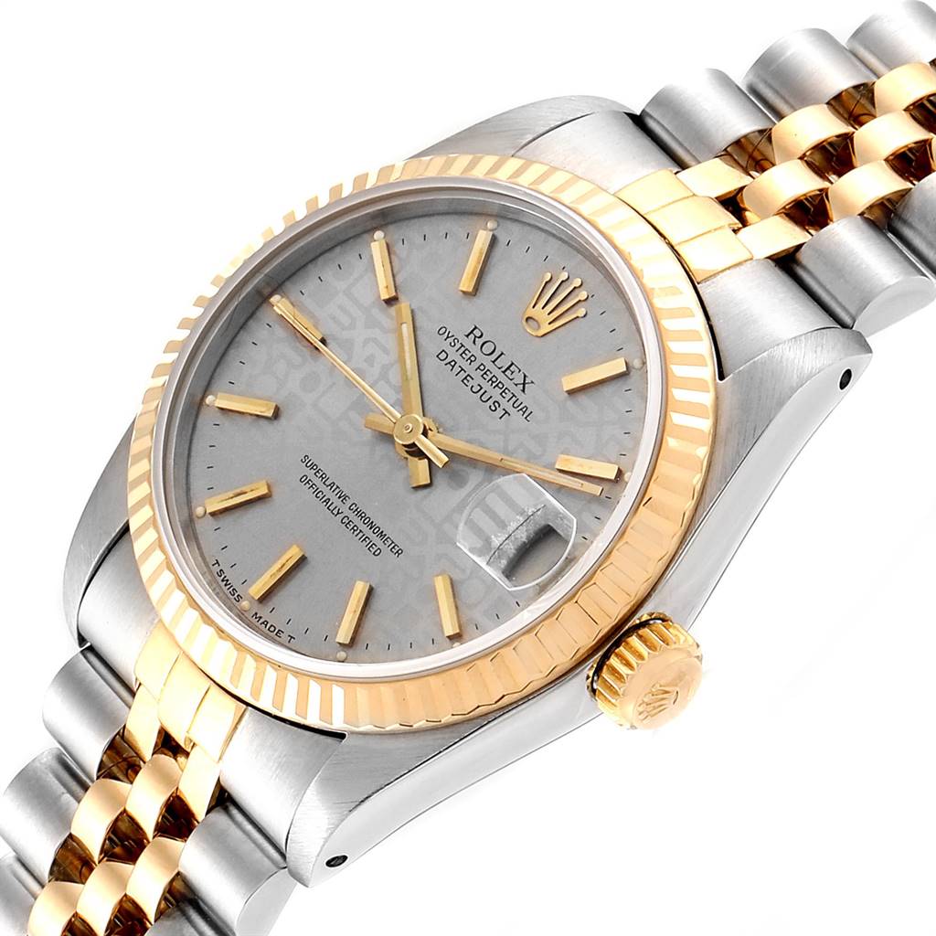 The image shows a close-up of a Rolex Mid-Size 68273 Women's Steel and Gold (two tone) Silver Dial 68273 Women's Steel and Gold (two tone) Silver Dial Datejust watch featuring the dial, crown, and part of the bracelet.