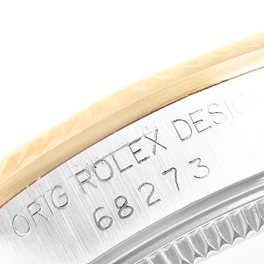 Close-up of the side of the mid-size Rolex watch, showing the engraved model number "68273" and "Rolex Design" text.