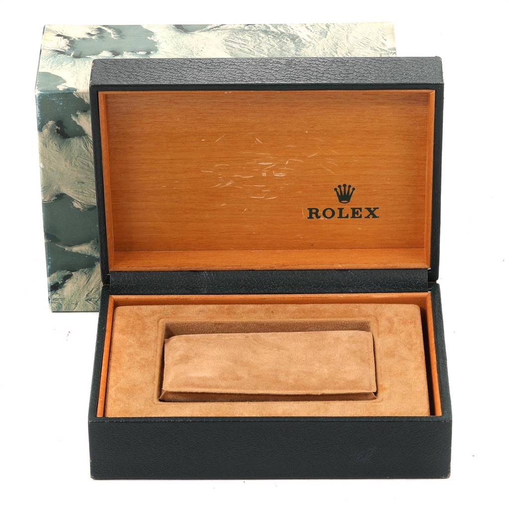 The image shows an open Rolex watch box for a Mid-Size model, with a cushion inside for holding the watch.