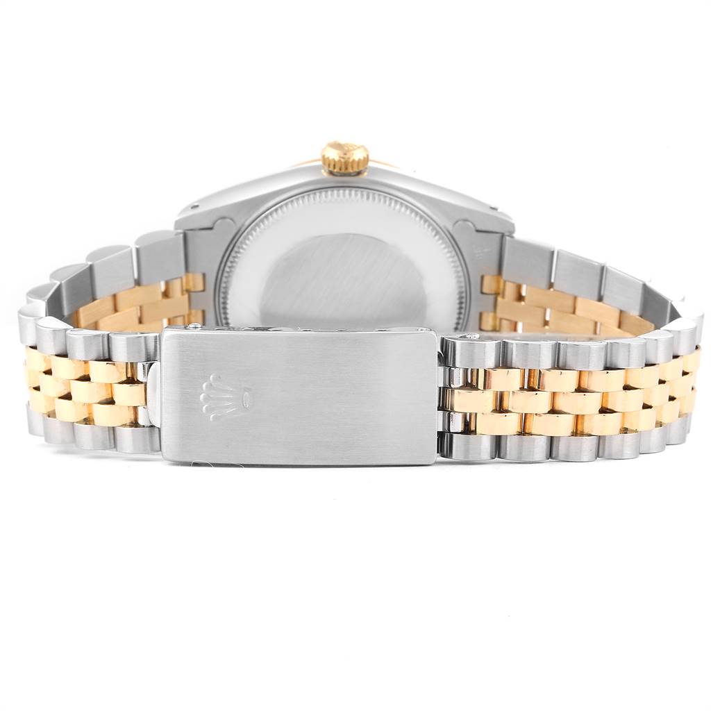 The image shows the back view of a Rolex Mid-Size 68273 Women's Steel and Gold (two tone) Black Dial 68273 Women's Steel and Gold (two tone) Black Dial model, highlighting the stainless steel and gold bracelet and the clasp.