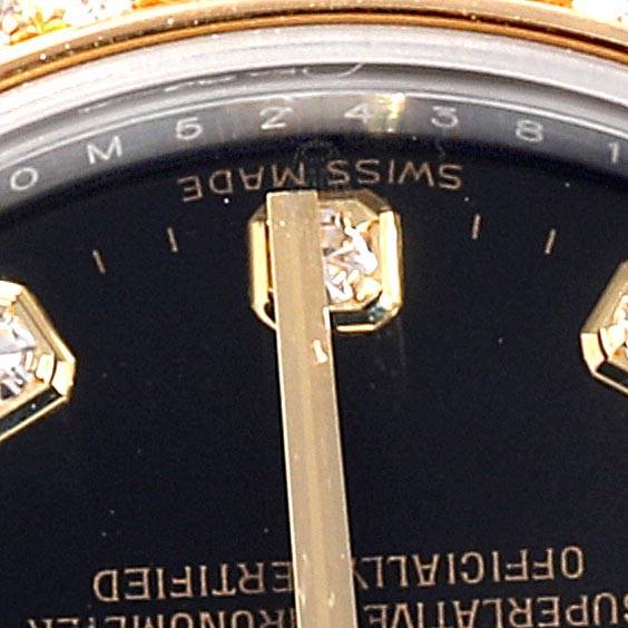 This close-up angle shows the dial, hour markers, and hands of the Rolex Mid-Size 178383 Women's Steel and Gold (two tone) Black Dial 178383 Women's Steel and Gold (two tone) Black Dial watch.