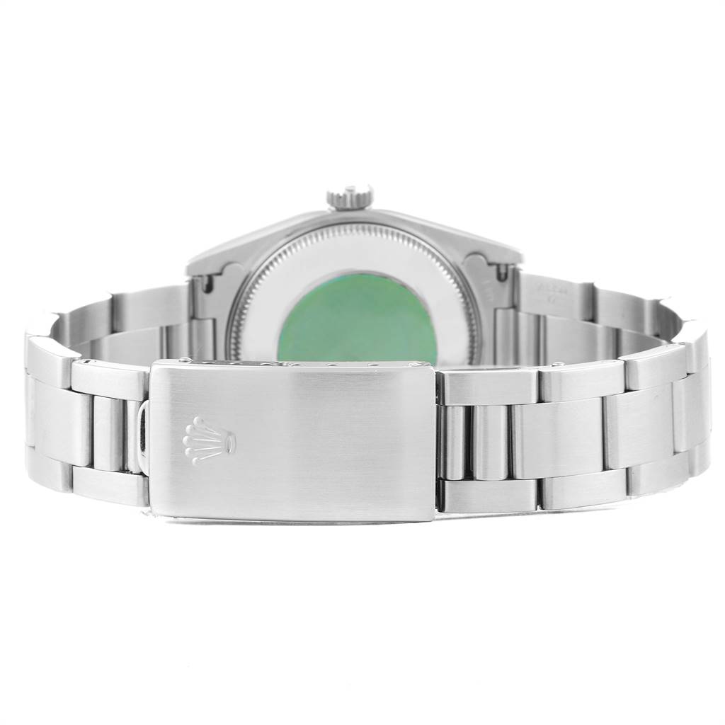 The image shows the back view of a Mid-Size Rolex watch, focusing on the clasp and bracelet.