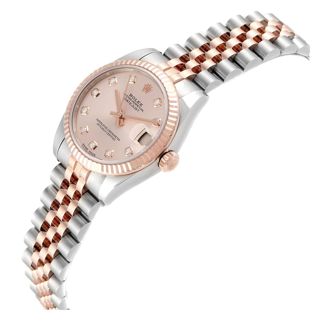 The image shows a mid-size Rolex watch at an angle highlighting its dial, crown, bezel, and two-tone bracelet.