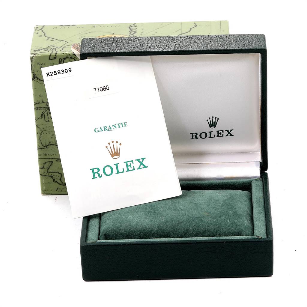 The image shows the packaging of a Mid-Size Rolex watch with its green box and warranty card.