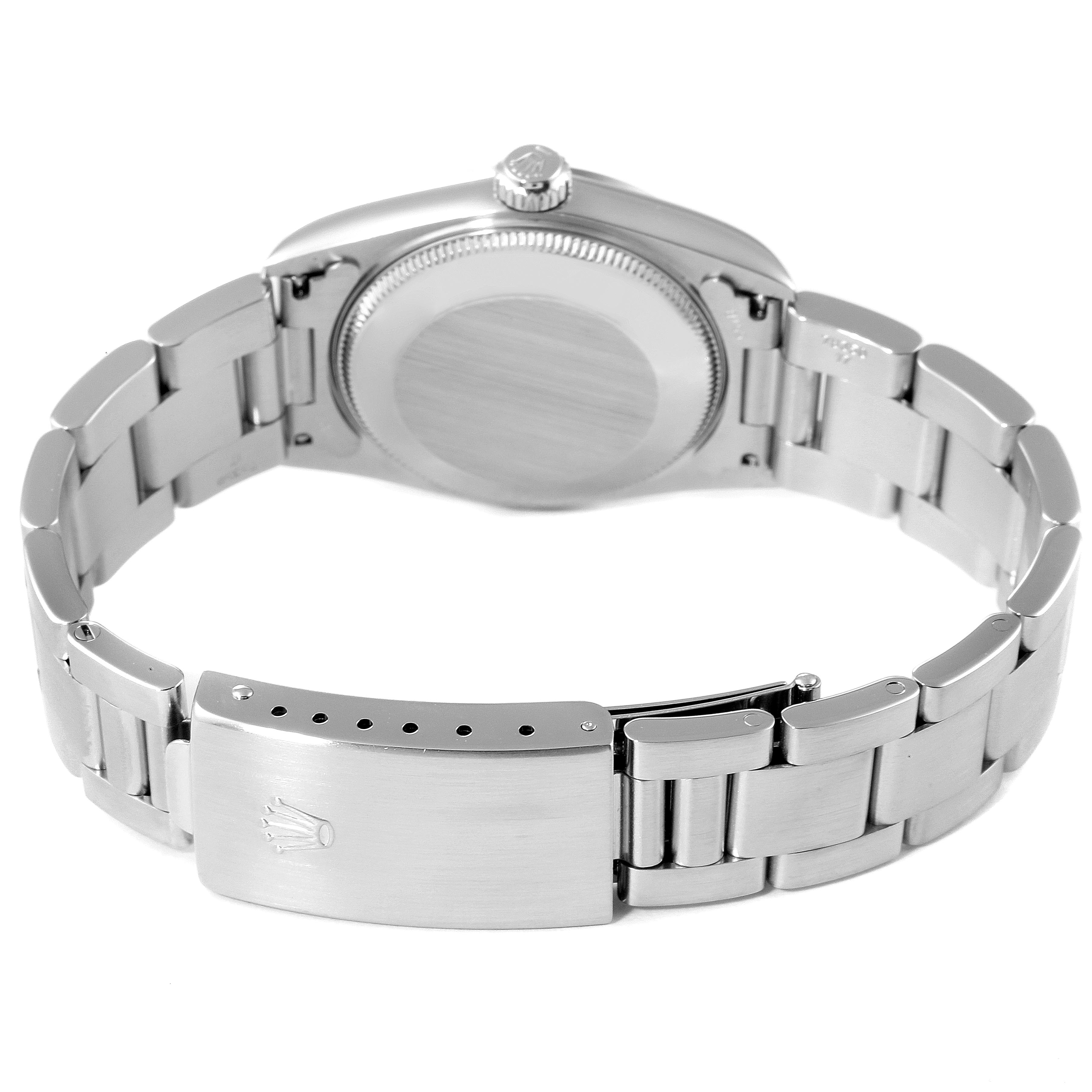 The image shows the back view of a Rolex Mid-Size 77080 Women's Stainless Steel Black Dial 77080 Women's Stainless Steel Black Dial watch, highlighting the case back, crown, and bracelet with the clasp visible.