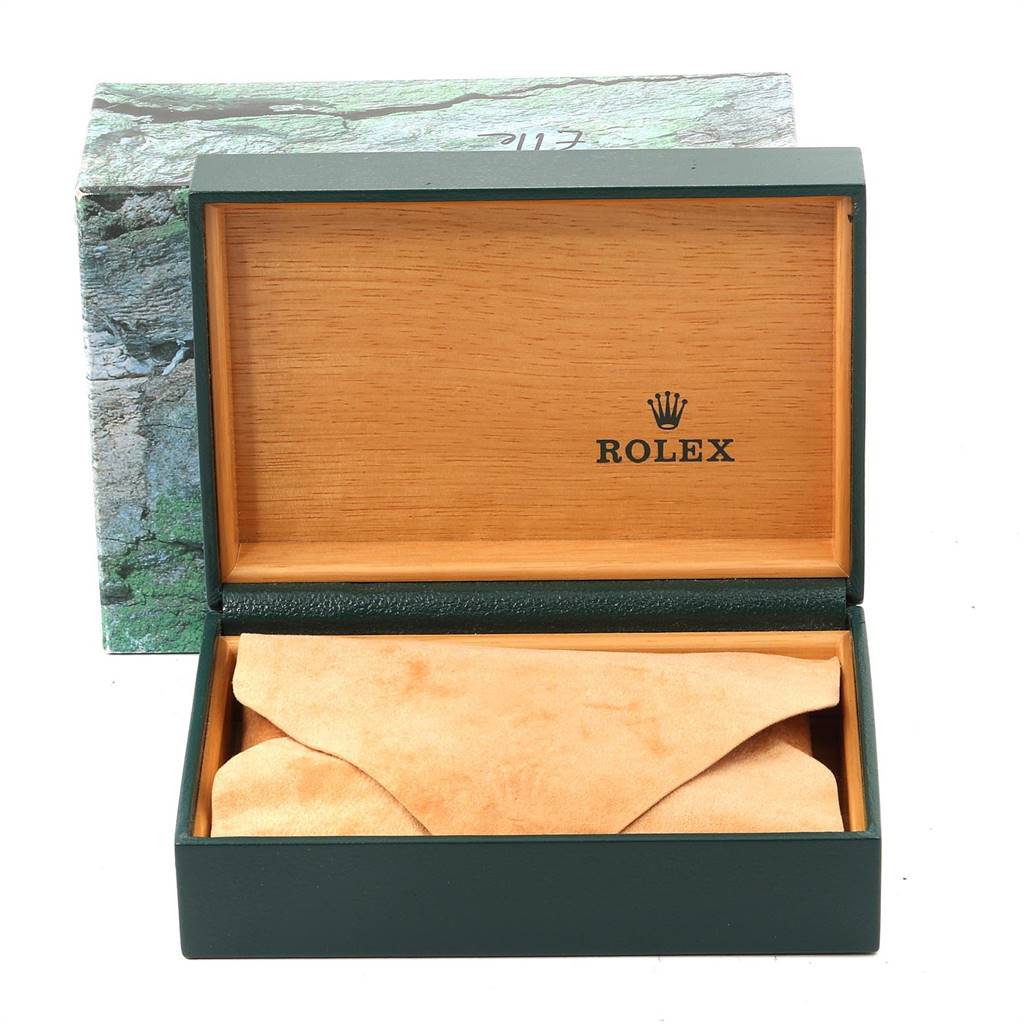The image shows an open Rolex watch box with no watch visible inside, just the interior and outer box.