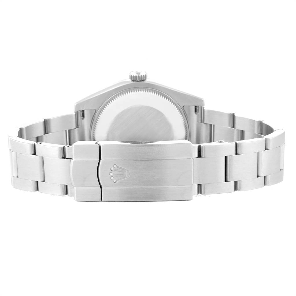 The image shows the back view of a Mid-Size Rolex watch, including the case and bracelet clasp.