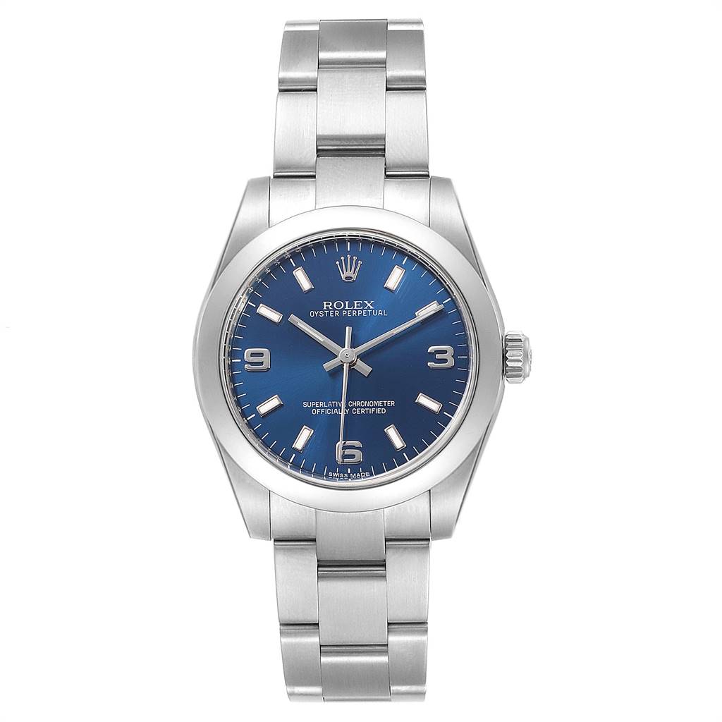 The image shows a front view of a Rolex Oyster Perpetual Mid-Size watch with a blue dial and silver bracelet.