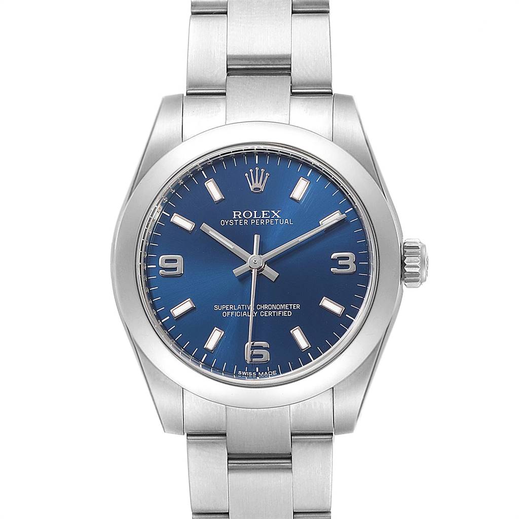 This image shows a Rolex Oyster Perpetual Mid-Size watch from a front angle, displaying its blue dial and silver bracelet.