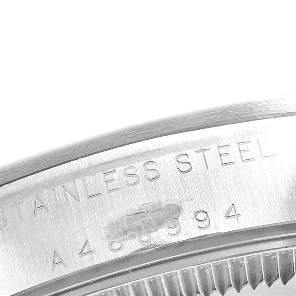 This image shows a close-up angle of the bracelet clasp on a Rolex Mid-Size 77080 Women
s Stainless Steel Black Dial 77080 Women
s Stainless Steel Black Dial model, highlighting the "STAINLESS STEEL" engraving.