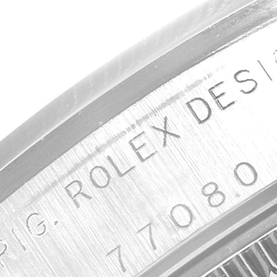 This image shows a close-up view of the case side with engraving on a Rolex Mid-Size 77080 Women
s Stainless Steel Black Dial 77080 Women
s Stainless Steel Black Dial model watch.