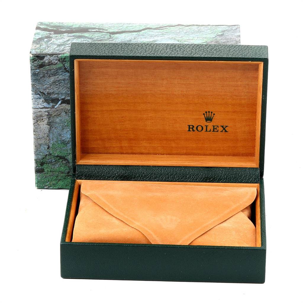 This image shows the opened packaging box and a tan velvet pouch for the Rolex Mid-Size 77080 Women's Stainless Steel Black Dial 77080 Women's Stainless Steel Black Dial model watch.