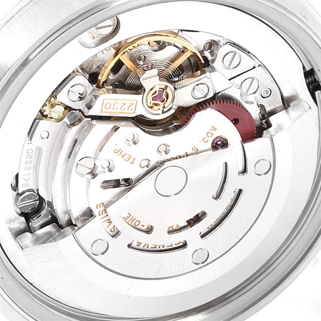 The image shows a close-up of the internal movement mechanism of a Rolex Mid-Size 77080 Women's Stainless Steel Black Dial 77080 Women's Stainless Steel Black Dial watch from an angled side view.