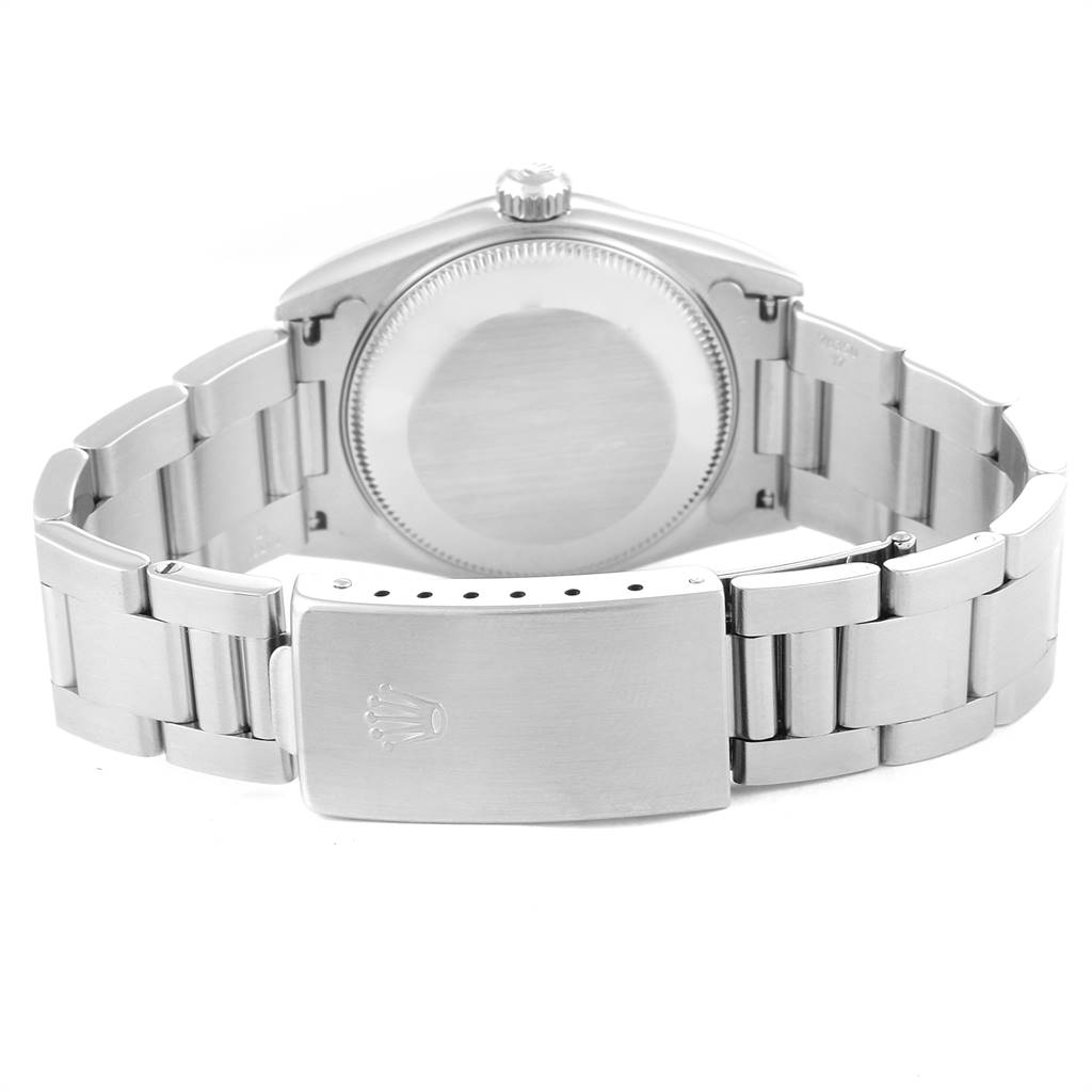 This image shows the back view of a Mid-Size Rolex watch, highlighting the case back, clasp, and bracelet.