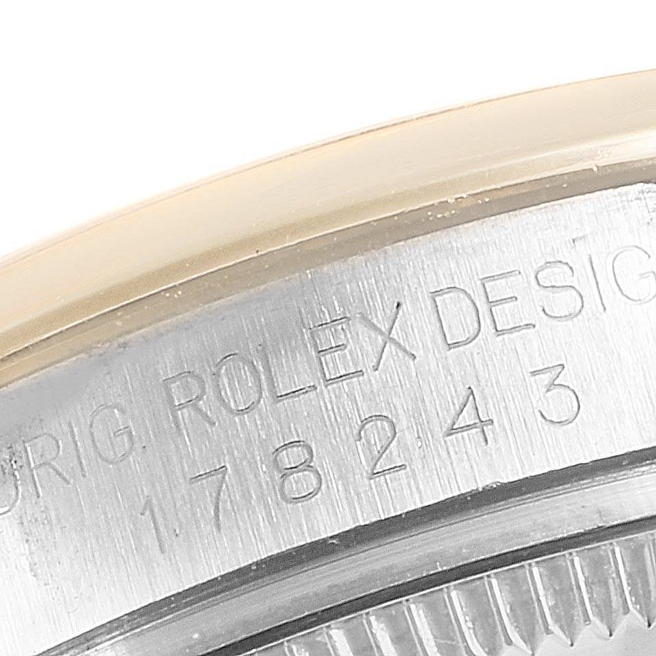 The image shows a close-up of the serial number engraving on the stainless steel case back of a Mid-Size Rolex watch.
