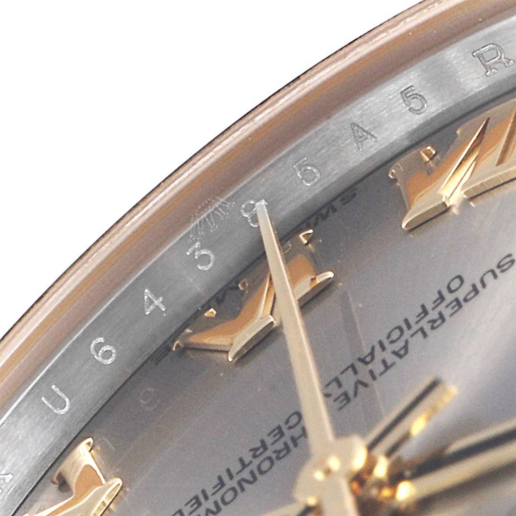 The image shows a close-up of the dial and part of the bezel of a Mid-Size Rolex watch.