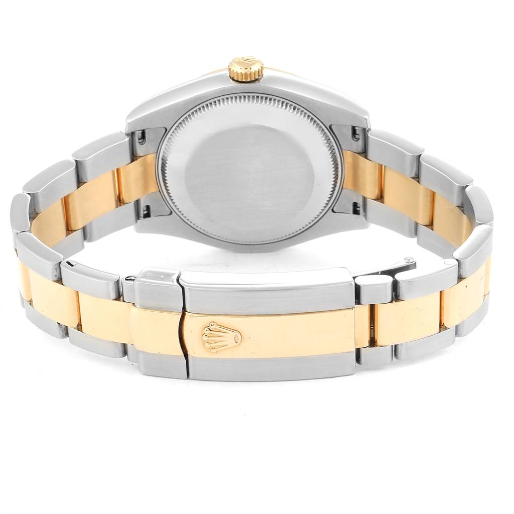 The image shows the back view of a Rolex Mid-Size 178243 Women's Stainless Steel Grey Dial 178243 Women's Stainless Steel Grey Dial watch, highlighting its stainless steel and gold bracelet and the case back.