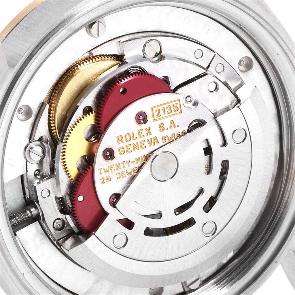 This image shows an internal view of the movement mechanism of a Rolex Mid-Size 68273 Women's Steel and Gold (two tone) Champagne Dial 68273 Women's Steel and Gold (two tone) Champagne Dial model watch.