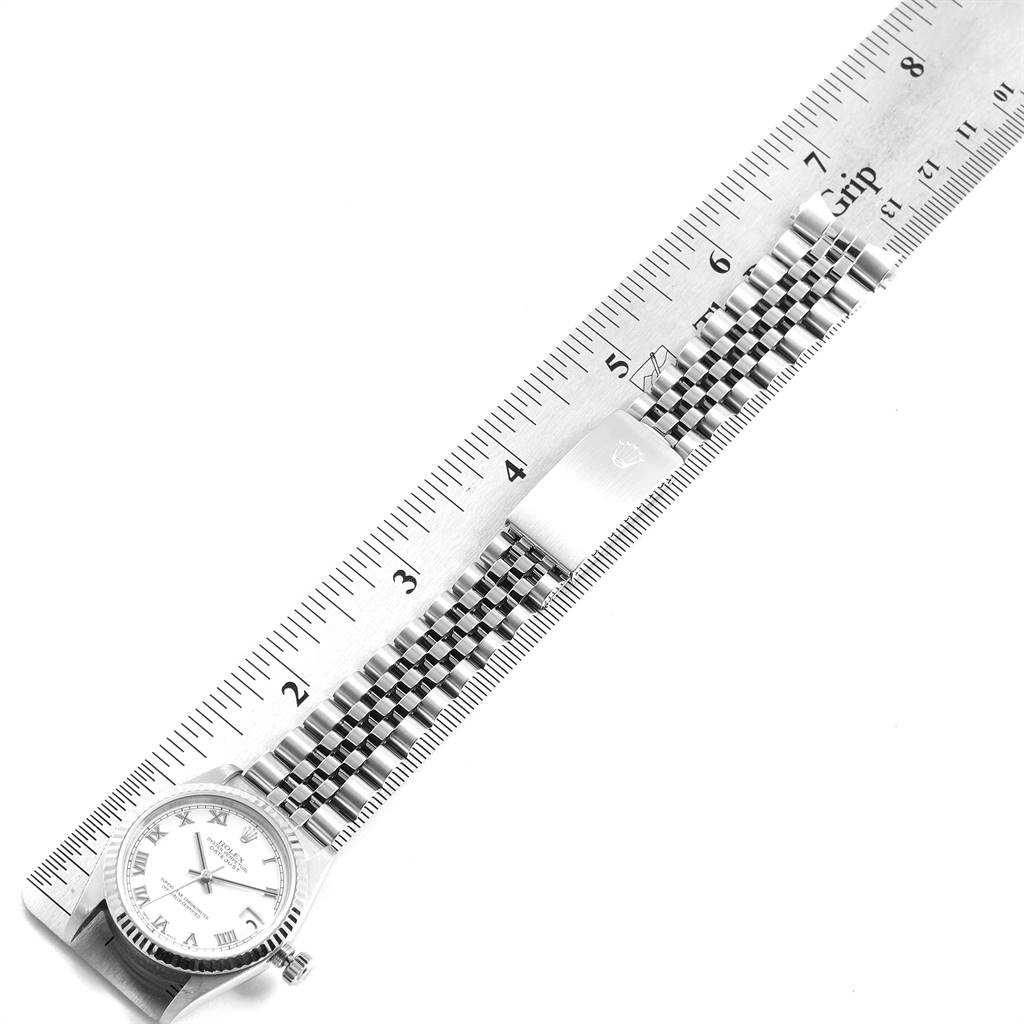 The image shows a Rolex Mid-Size 78274 Women's Stainless Steel White Dial 78274 Women's Stainless Steel White Dial watch, displaying the front face, bracelet, and clasp, aligned with a ruler for measurement.