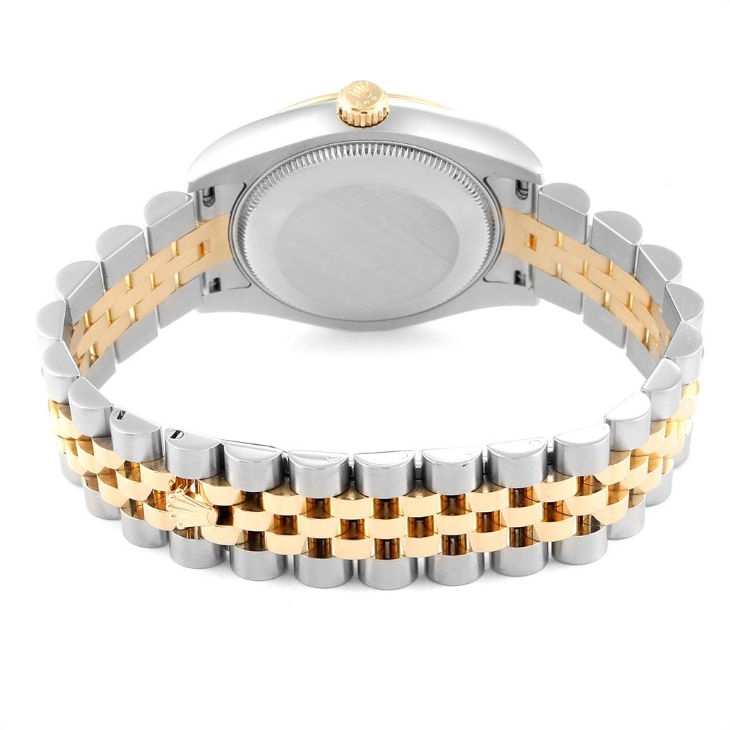 The image shows the back side of a Rolex Mid-Size 178273 Women's Steel and Gold (two tone) Silver Dial 178273 Women's Steel and Gold (two tone) Silver Dial model watch, highlighting the case back, crown, and two-tone bracelet.