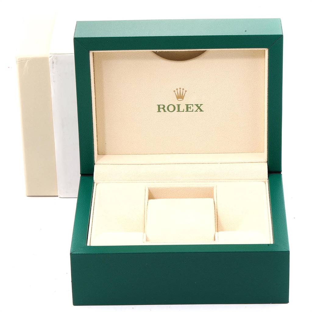 The image shows an open Rolex watch box, featuring the brand logo and slots for storing a Mid-Size Rolex watch and accessories.