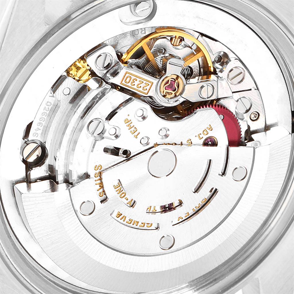 This image shows a detailed close-up of the internal mechanical movement of a Rolex Mid-Size 77080 Women
s Stainless Steel Blue Dial 77080 Women
s Stainless Steel Blue Dial watch.