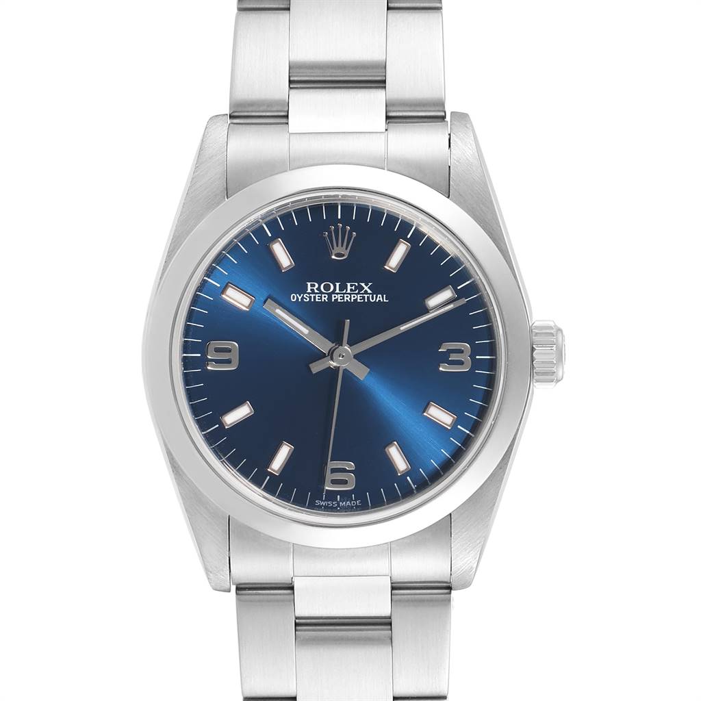 The image shows a front view of the Rolex Oyster Perpetual Mid-Size model, highlighting its blue dial and stainless steel bracelet.