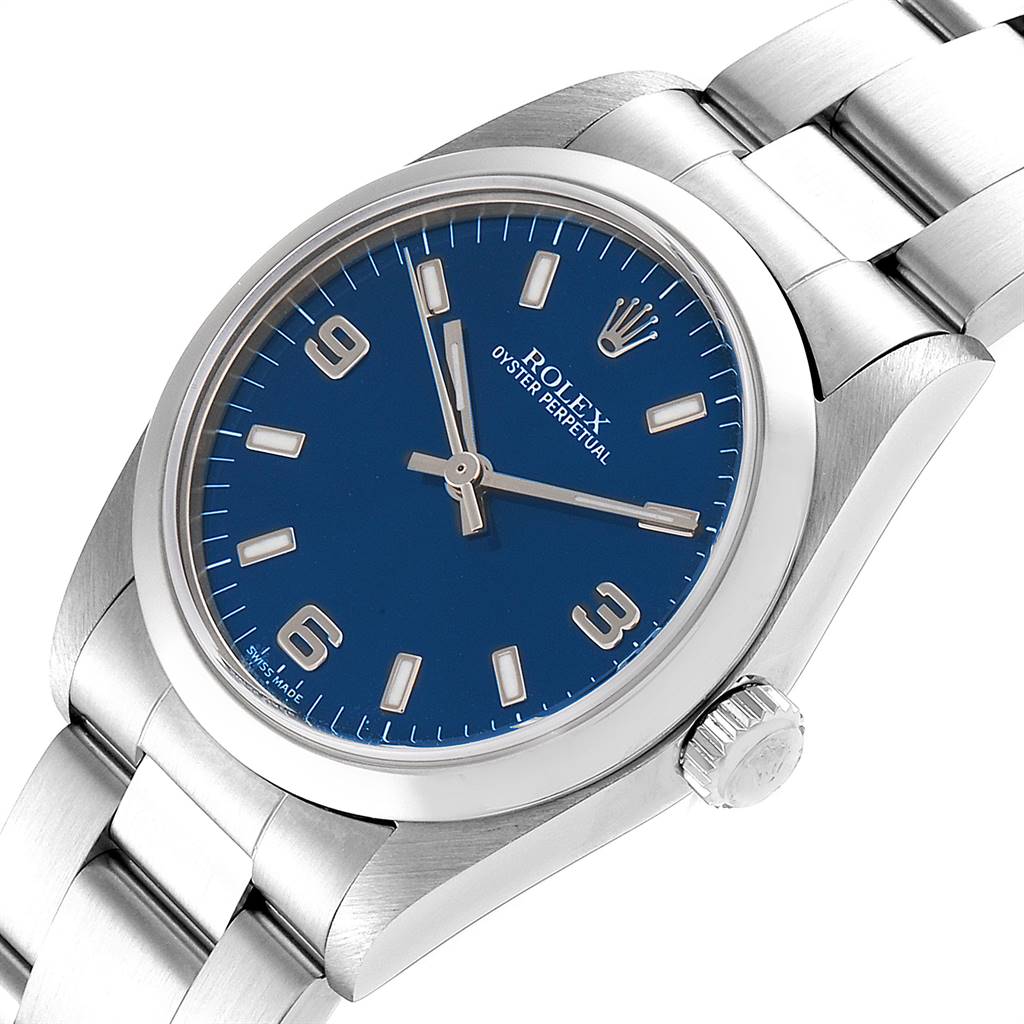 The image shows a Rolex Mid-Size 77080 Women
s Stainless Steel Blue Dial 77080 Women
s Stainless Steel Blue Dial Oyster Perpetual watch angled from the front, displaying the face, hands, crown, and part of the bracelet.