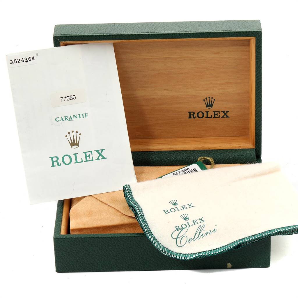 The image shows a Rolex box, warranty card, and cloth from a Mid-Size Rolex model, viewed from the top.
