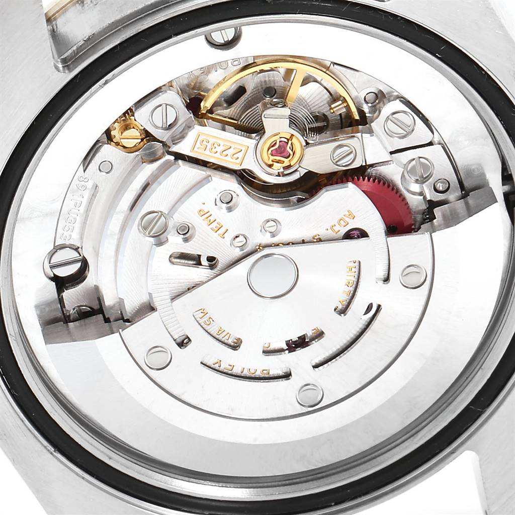 This image shows the movement mechanism of a Rolex Mid-Size 178273 Women's Steel and Gold (two tone) Champagne Dial 178273 Women's Steel and Gold (two tone) Champagne Dial model watch from a close-up, rear view angle.