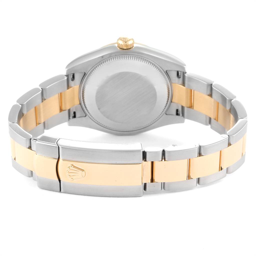 The image shows the back of a Mid-Size Rolex watch, displaying its closed clasp and two-tone metal bracelet.