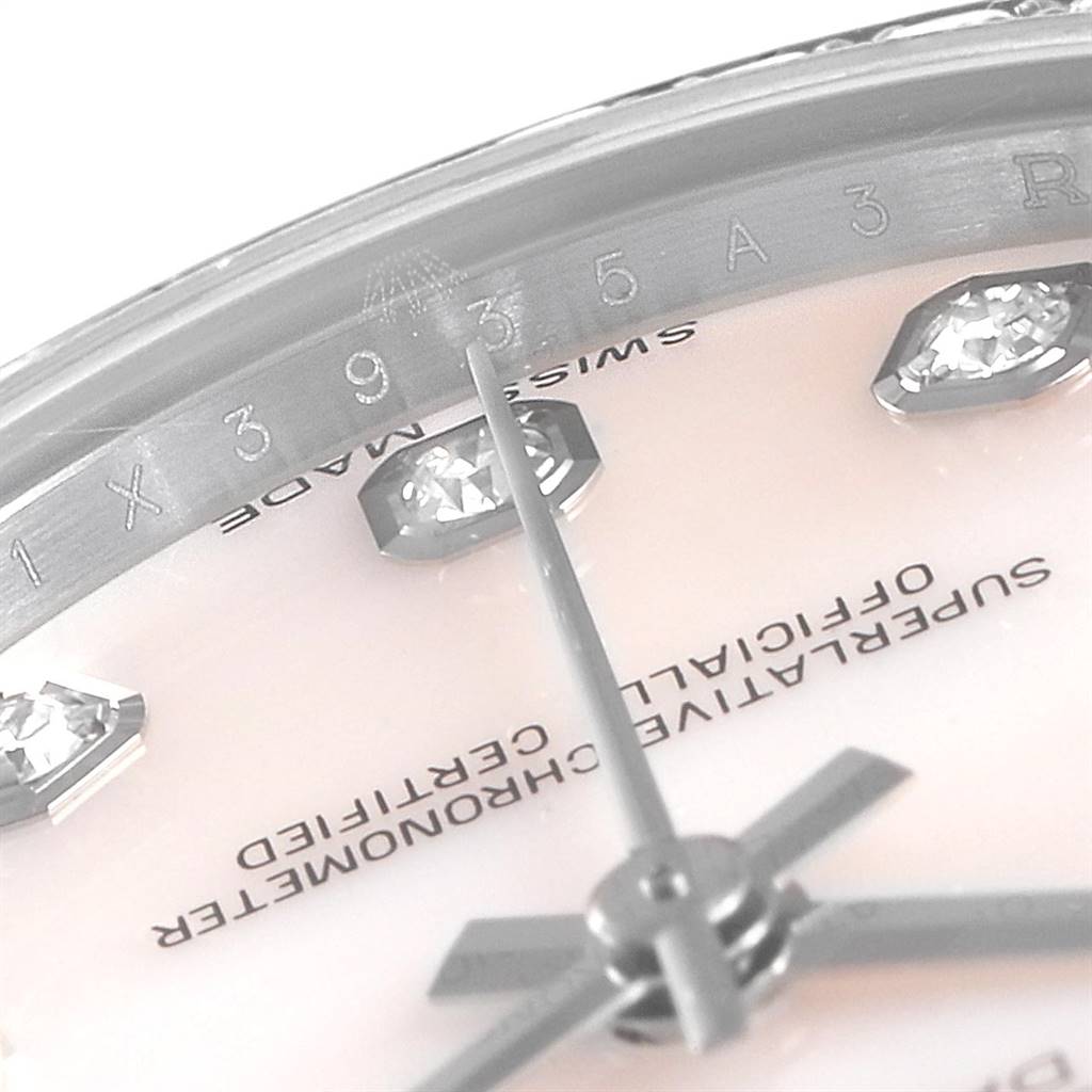 The image shows a close-up of the Rolex Mid-Size 178384 Women
s Stainless Steel Mother of Pearl Dial 178384 Women
s Stainless Steel Mother of Pearl Dial model watch dial, hands, and part of the bezel with diamond markers.