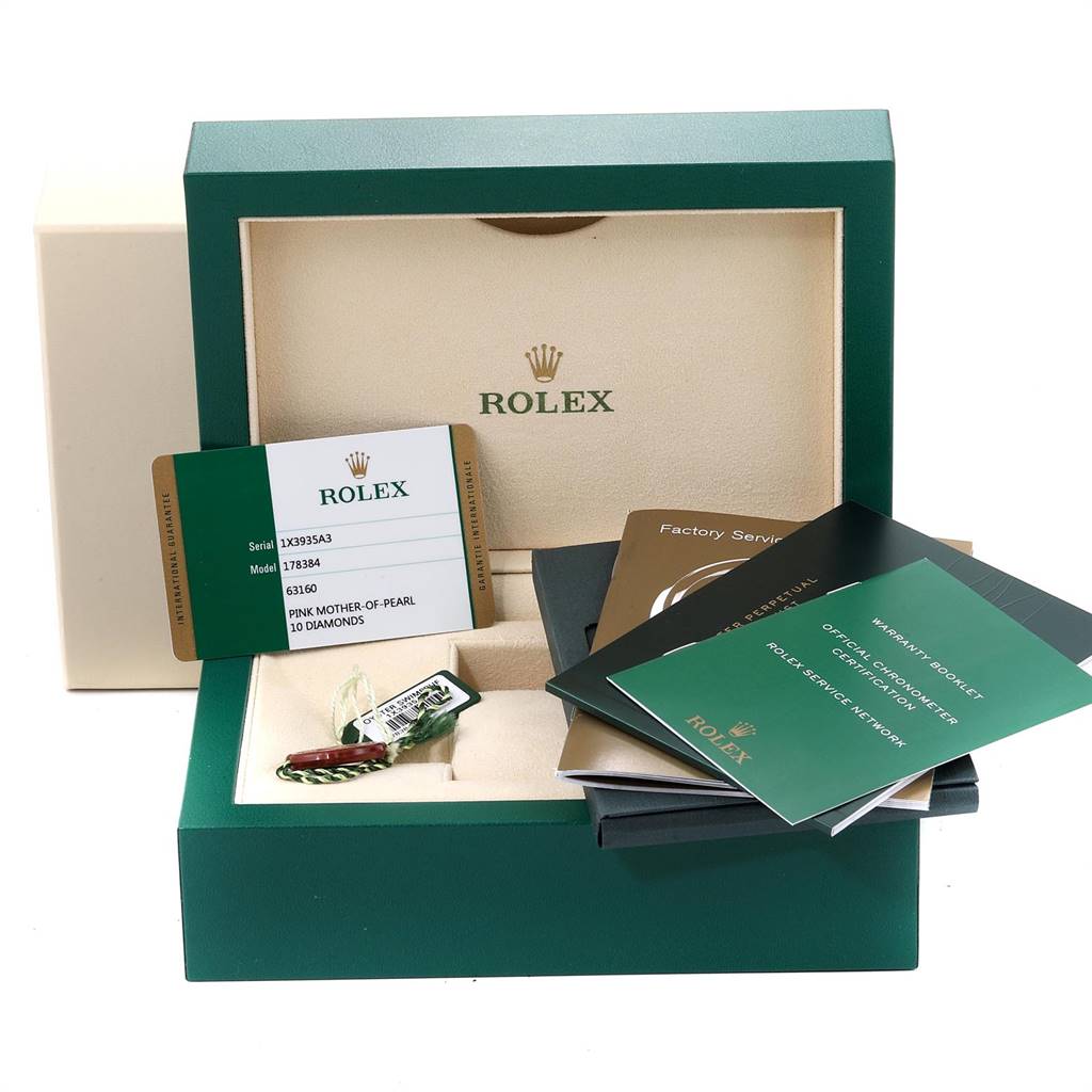 The image shows a Rolex Mid-Size 178384 Women
s Stainless Steel Mother of Pearl Dial 178384 Women
s Stainless Steel Mother of Pearl Dial model watch box containing warranty card, booklets, and tags from a top-down angle.