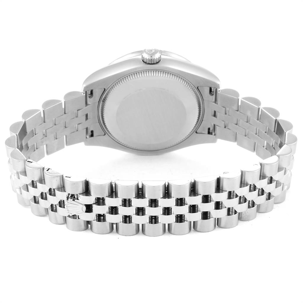 The image shows the back case, crown, and bracelet of a Mid-Size Rolex watch.