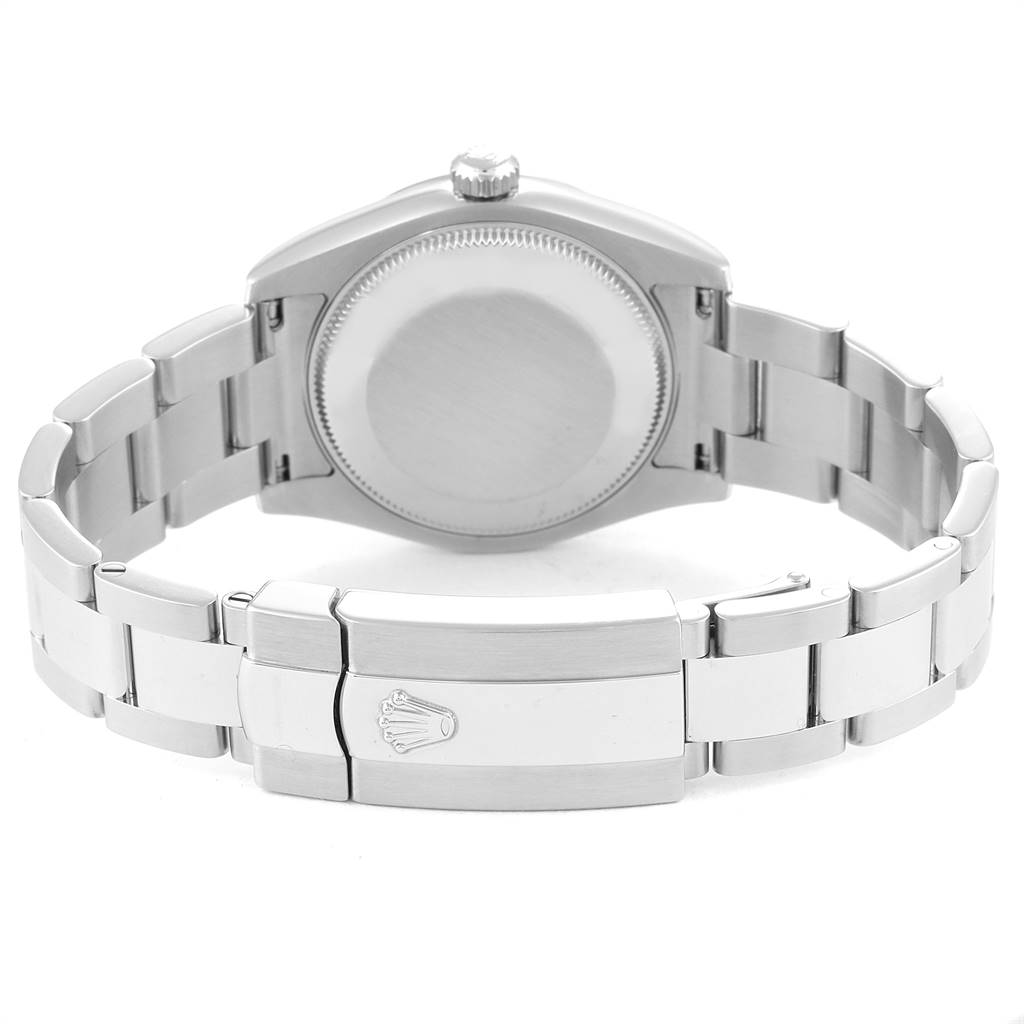 The image shows the back and clasp of a Mid-Size Rolex watch, emphasizing the bracelet and case back.