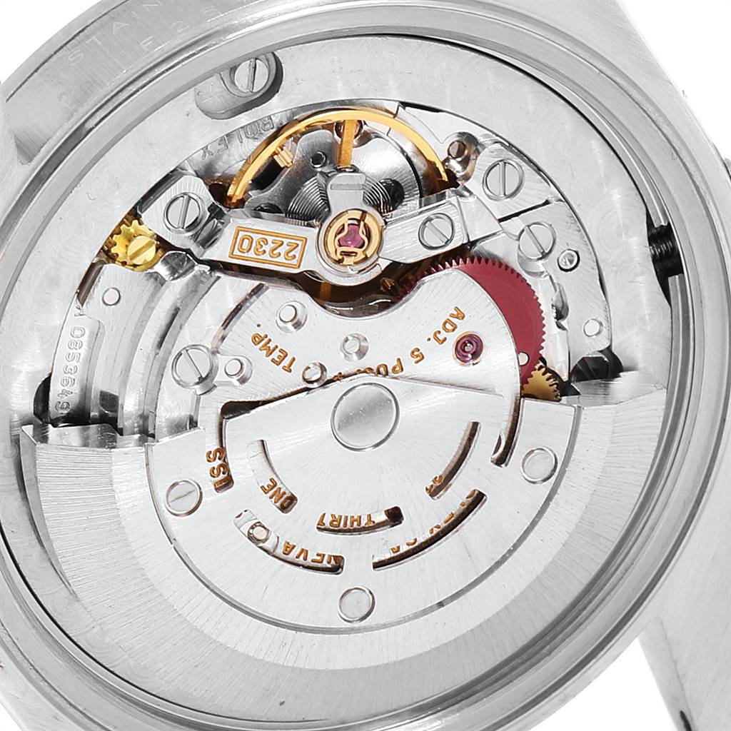 The image shows a close-up view of the internal mechanism of a Mid-Size Rolex watch.
