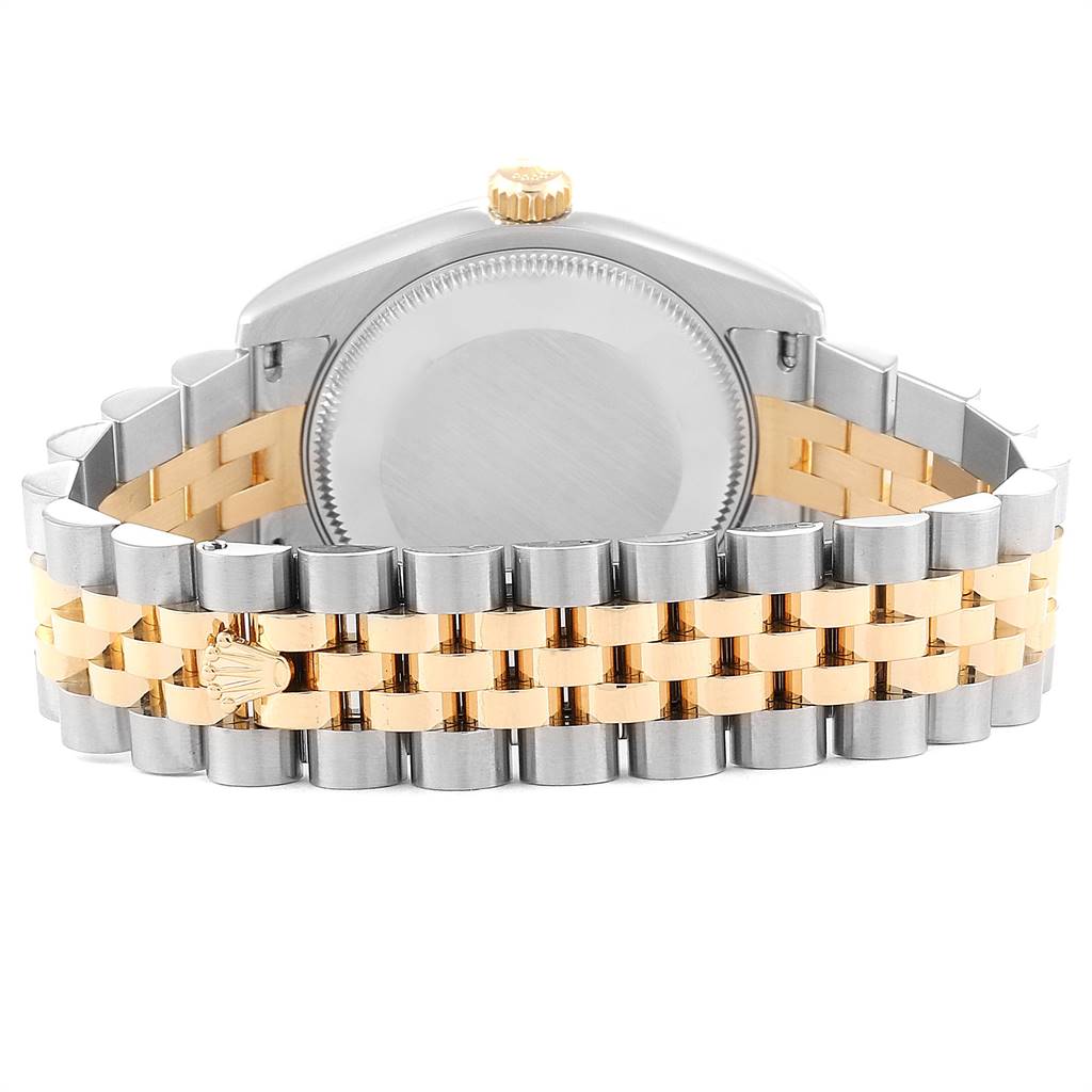 This image shows the back case and bracelet of a Rolex Mid-Size 178273 Women's Steel and Gold (two tone) White Dial 178273 Women's Steel and Gold (two tone) White Dial model in a two-tone design with gold and silver links.