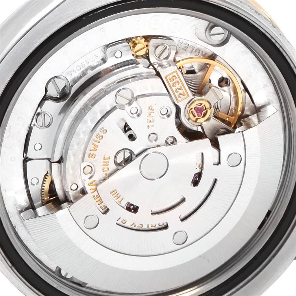 This image shows the internal mechanical components and movement of a Mid-Size Rolex watch from a close-up, rear angle.
