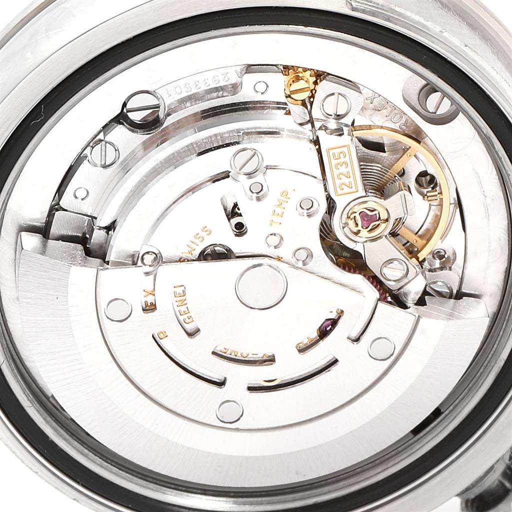 The image shows the movement mechanism of a Mid-Size Rolex watch from a close-up angle.